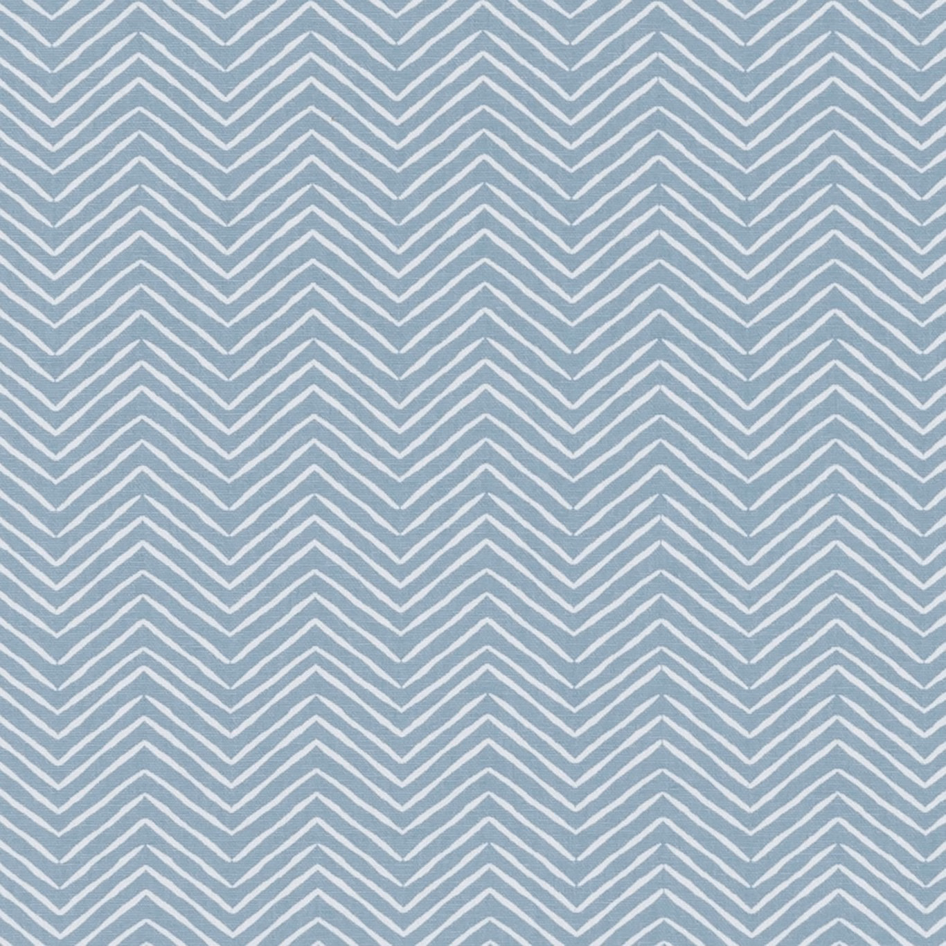 Muted chambray-blue textile with repeating pale ivory chevron stripes and woven texture