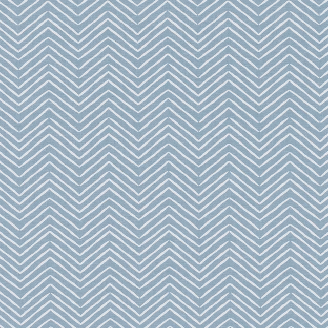 Muted chambray-blue textile with repeating pale ivory chevron stripes and woven texture