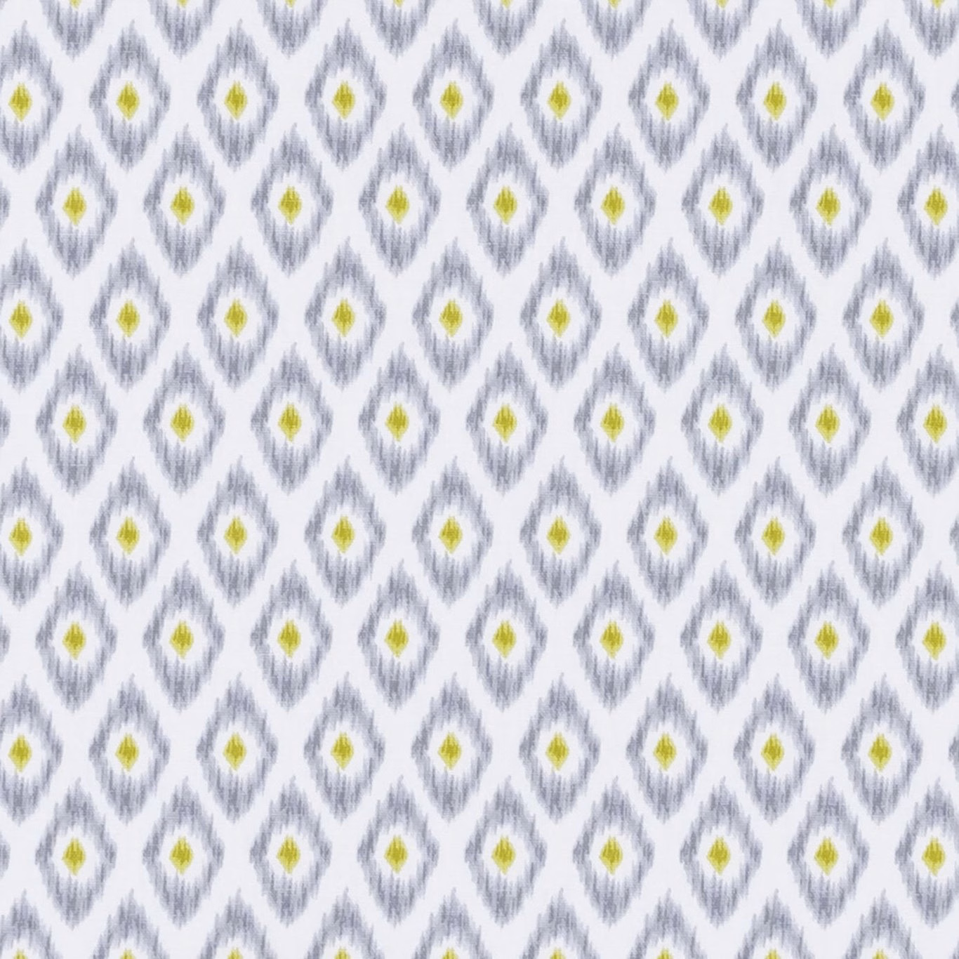 White textile with smoky grey diamond motifs and yellow-green centres