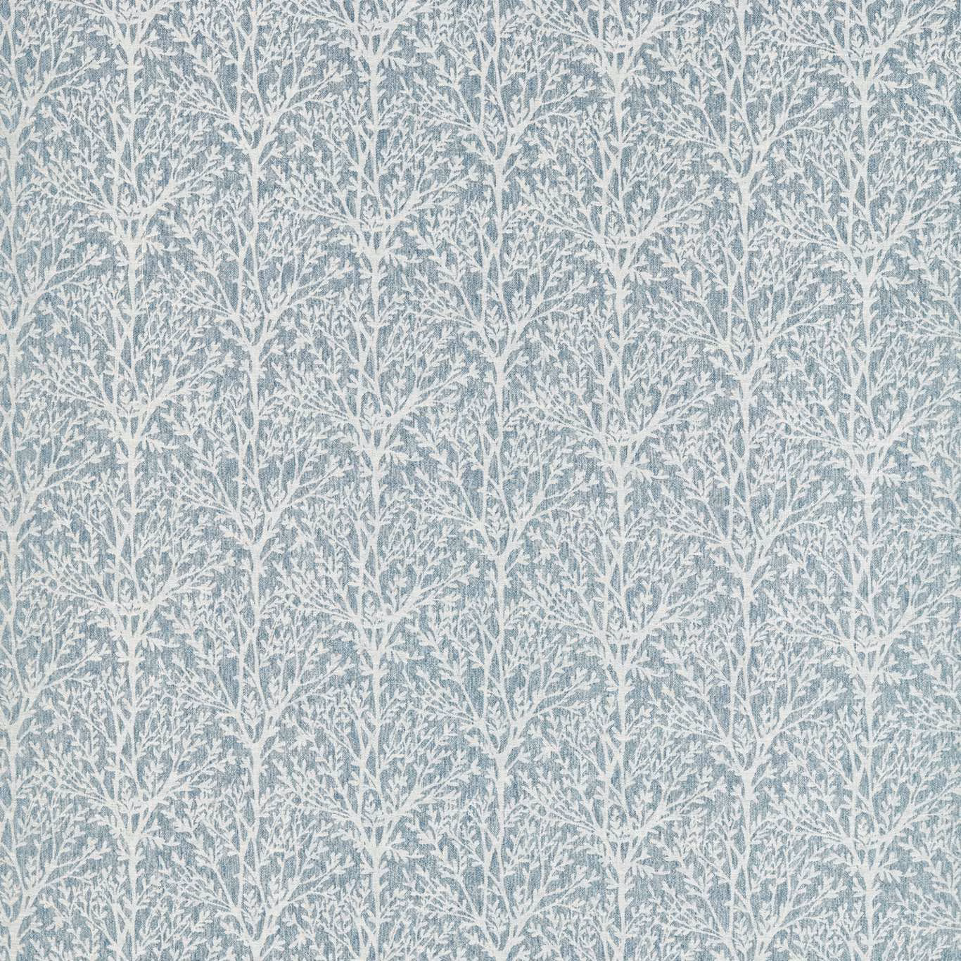 Muted denim-blue fabric with fine white branching foliage and a softly textured surface