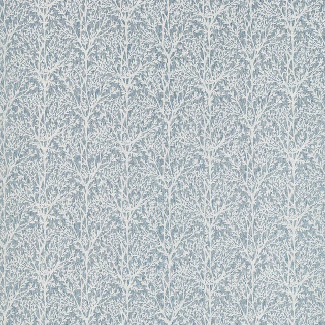Muted denim-blue fabric with fine white branching foliage and a softly textured surface
