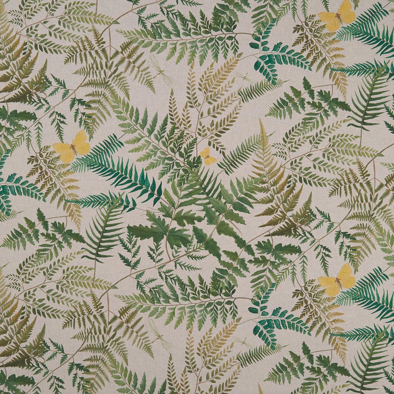 Oatmeal fabric covered in layered fern fronds, muted greens and golden-yellow accents
