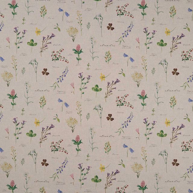 Warm greige woven fabric with scattered pink, green, lavender and yellow botanical sprigs