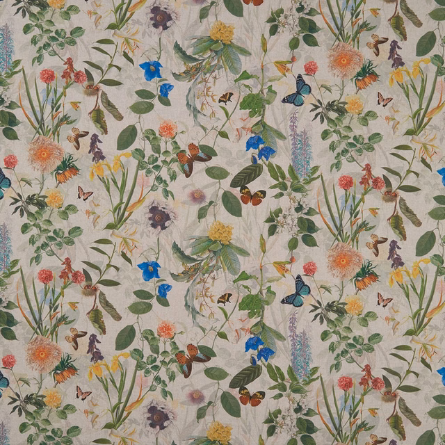 Warm ivory botanical fabric with blue butterflies, leafy stems and multicoloured flowers
