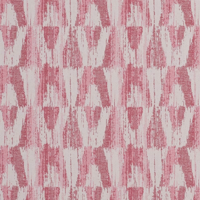 Close-up of raspberry pink and ivory woven ikat-style abstract fabric texture
