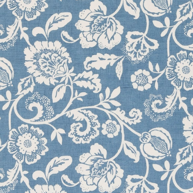 Muted chambray-blue ground with ivory scrolling flowers and leafy botanical motifs