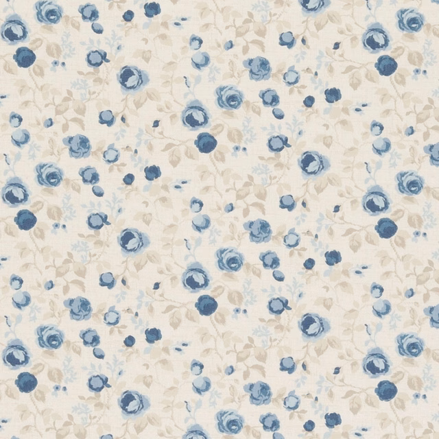 Cream floral textile with muted chambray-blue blossoms and pale leafy stems