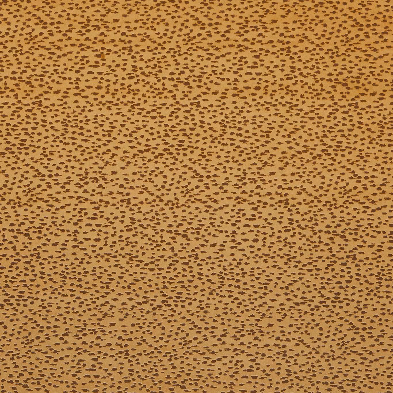 Warm ochre-gold woven ground with dense irregular dark brown flecks
