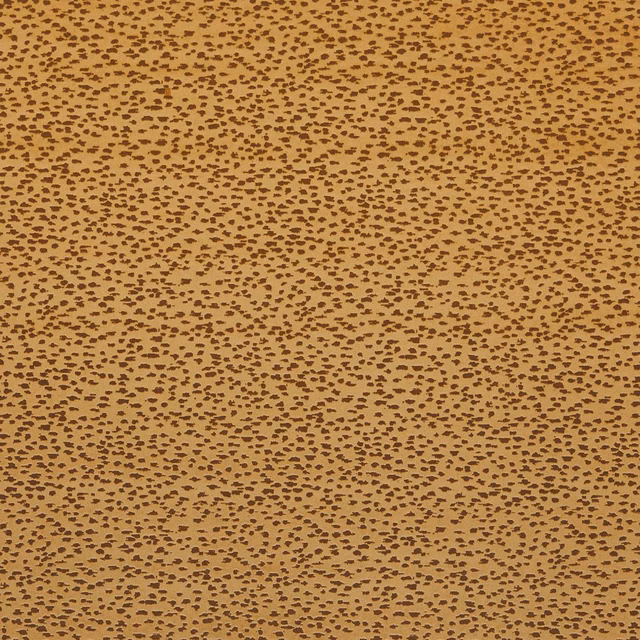 Warm ochre-gold woven ground with dense irregular dark brown flecks