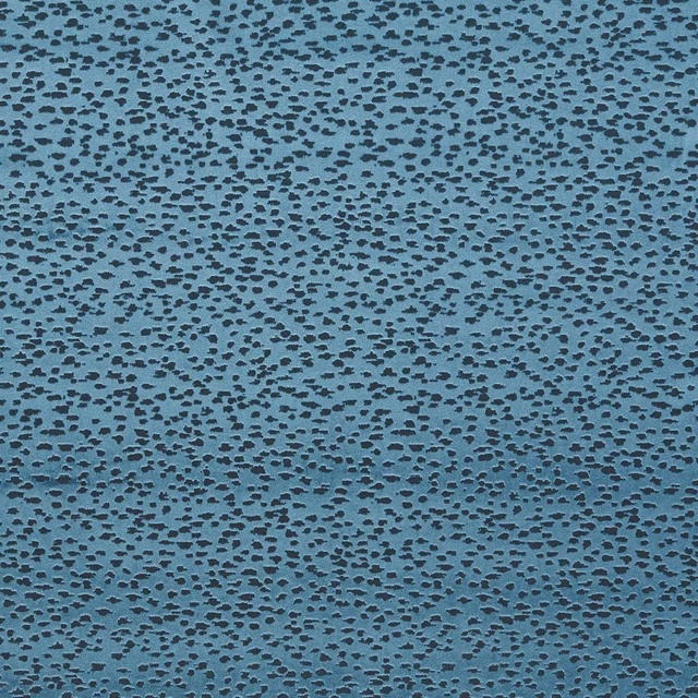 Blue-teal textile with dense charcoal flecks and a subtly textured surface