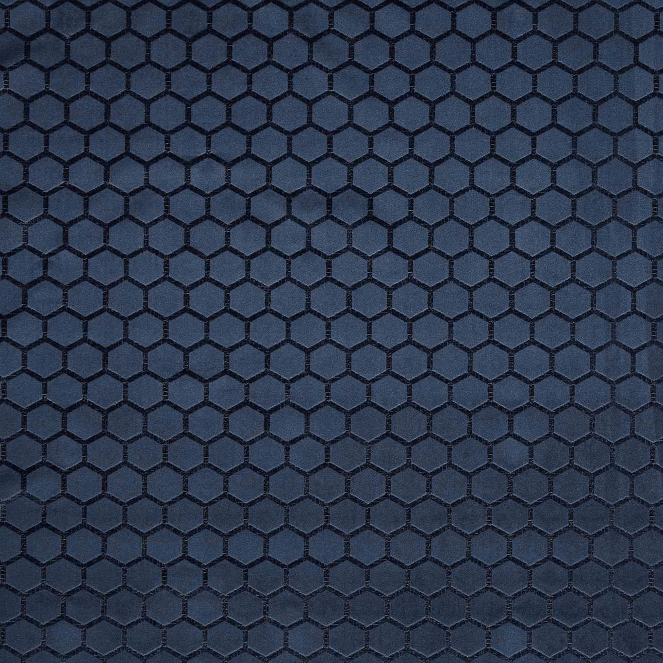 Deep midnight-blue textile with raised black hexagonal lattice and subtle woven sheen