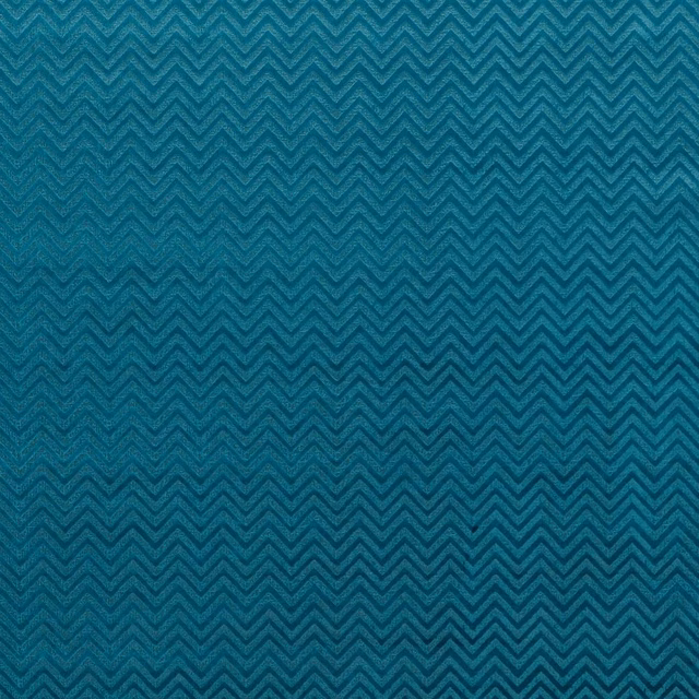 Deep peacock teal woven fabric with fine dark chevron zigzags and tactile texture