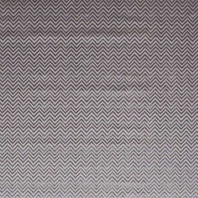 Smoky grey woven fabric with fine charcoal zigzag chevron pattern and subtle texture