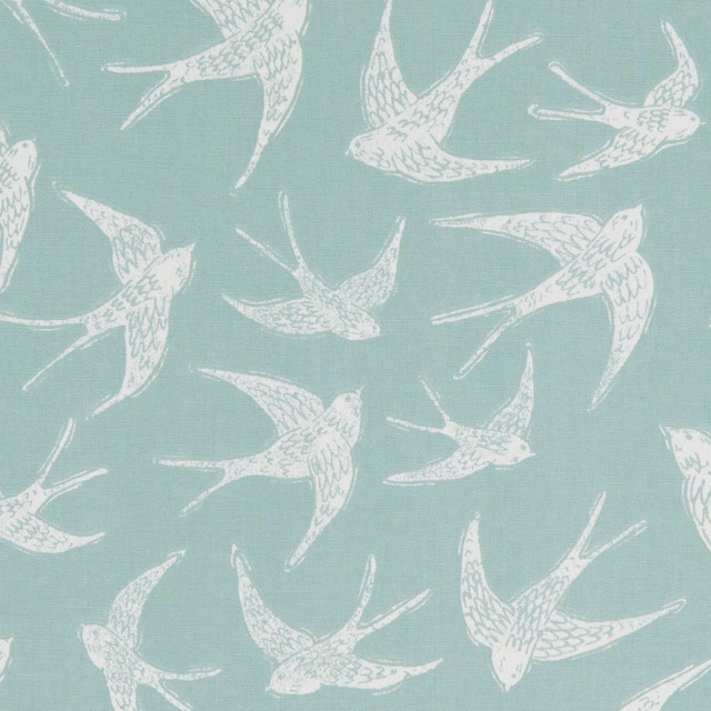 Muted mineral aqua fabric with cream flying swallows and fine woven texture