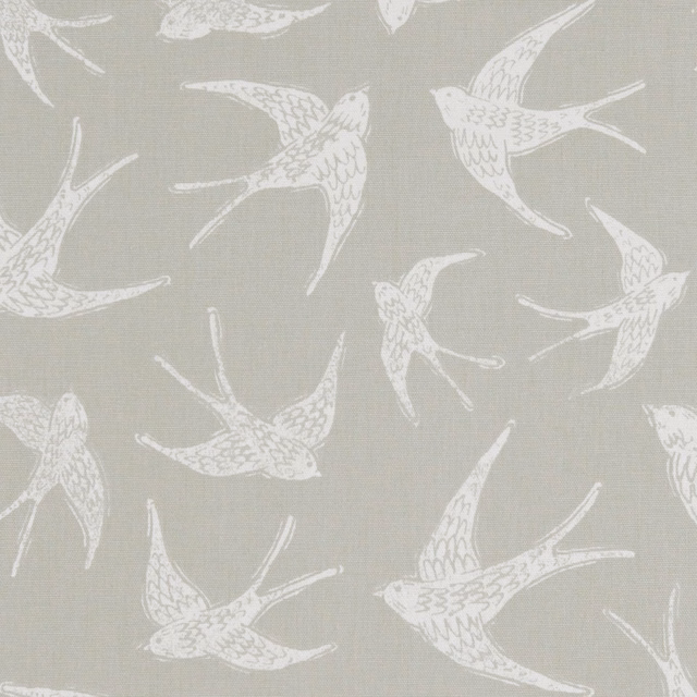 Muted taupe woven fabric with off-white flying swallows and fine visible texture
