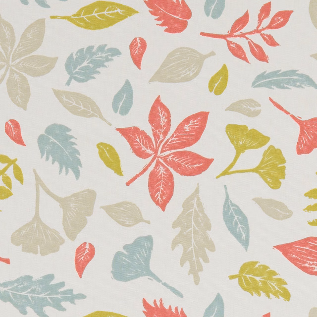 Ivory textile with coral, sage, ochre and stone leaf motifs