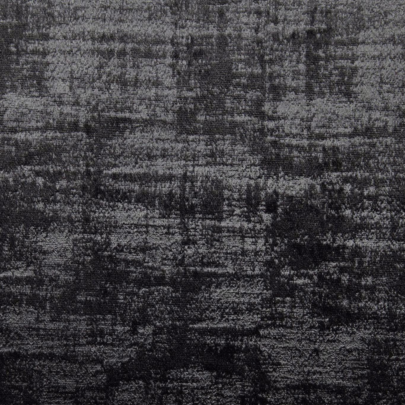 Charcoal-black fabric with mottled horizontal striations and fine pale woven flecks