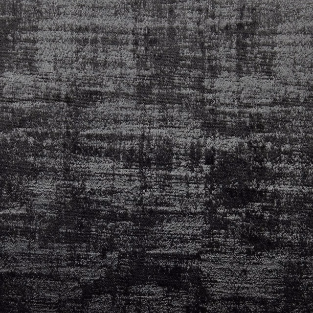 Charcoal-black fabric with mottled horizontal striations and fine pale woven flecks