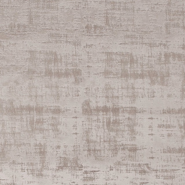Close-up of soft taupe fabric with distressed grey-beige brush marks and textured surface
