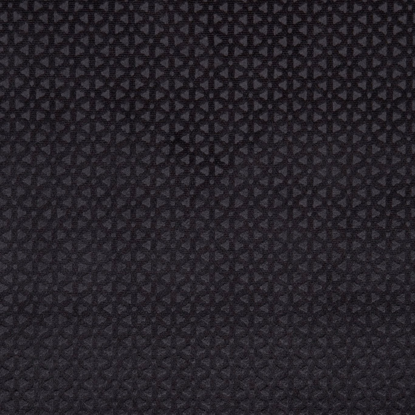 Deep charcoal-black woven fabric with a tiny interlocking geometric pattern and textured surface