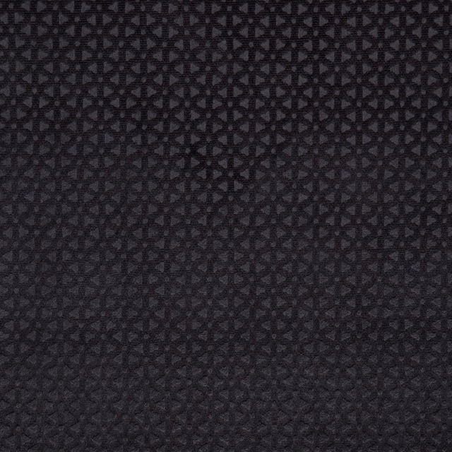 Deep charcoal-black woven fabric with a tiny interlocking geometric pattern and textured surface