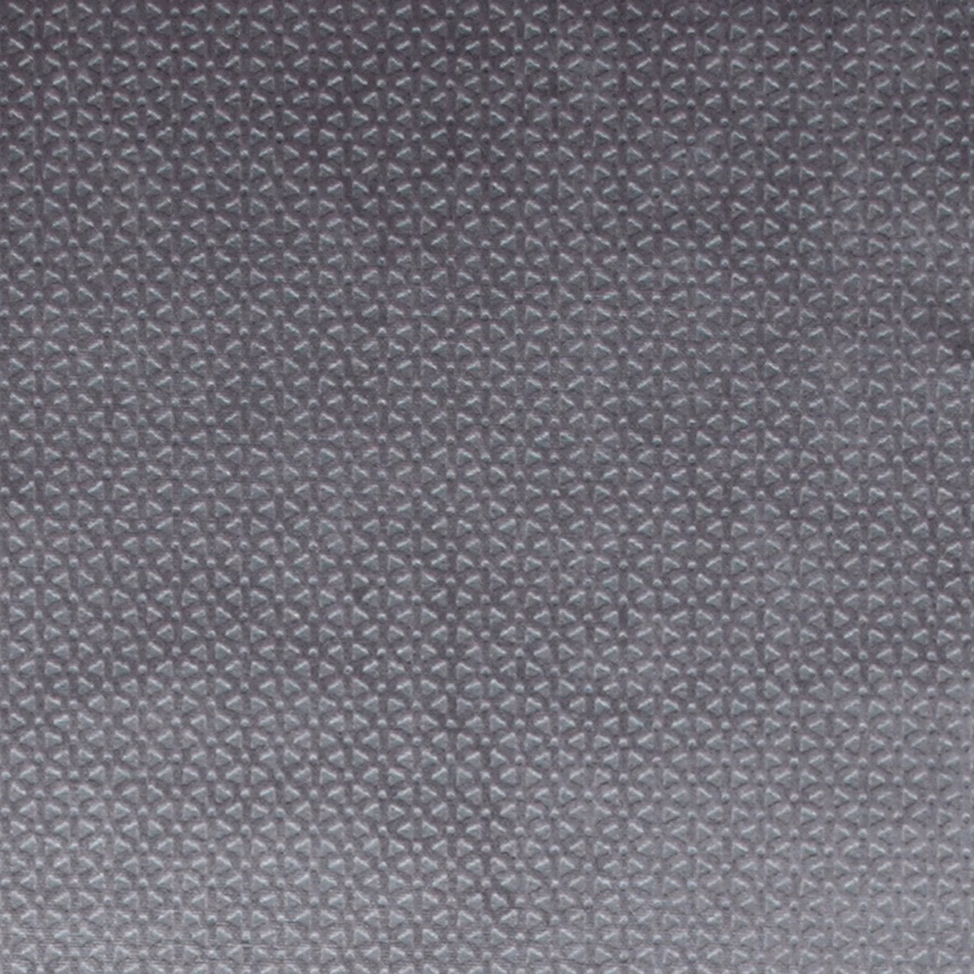 Close-up of smoky grey woven fabric with tiny repeating geometric texture