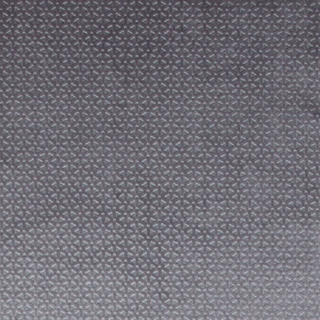 Close-up of smoky grey woven fabric with tiny repeating geometric texture