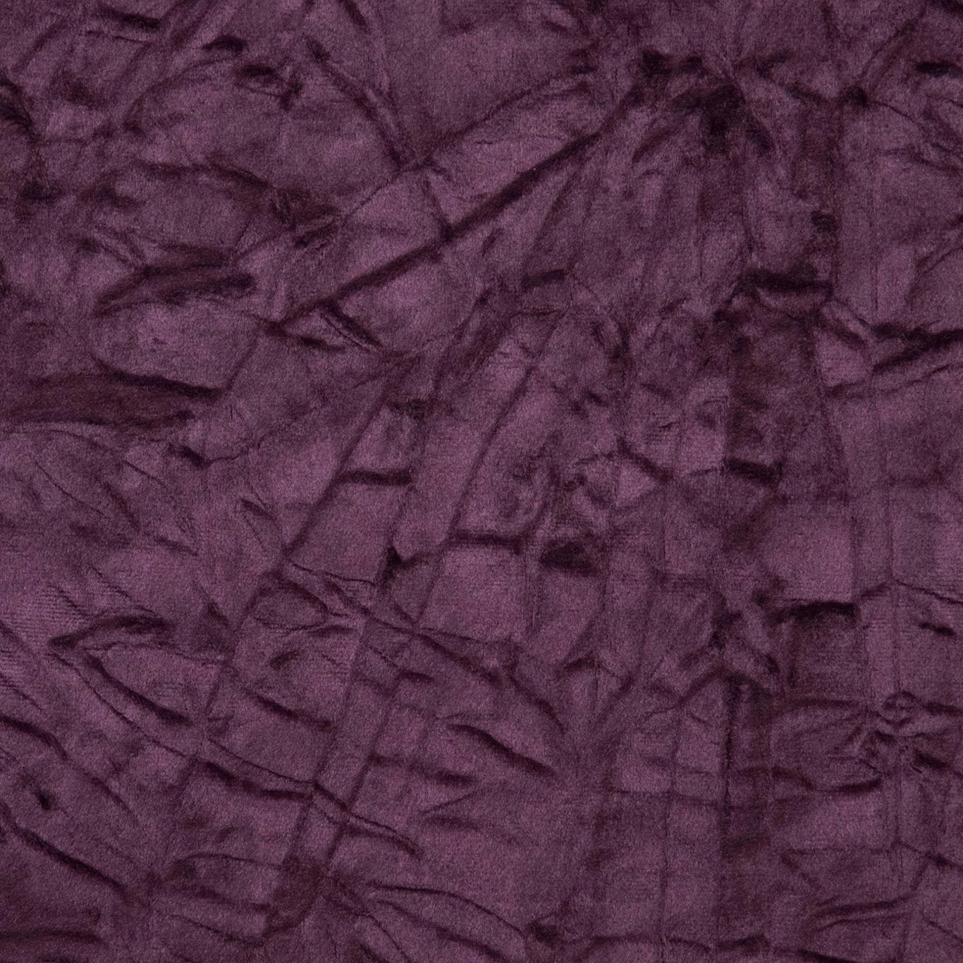 Deep aubergine textile with crushed plum texture and dark irregular tonal creases
