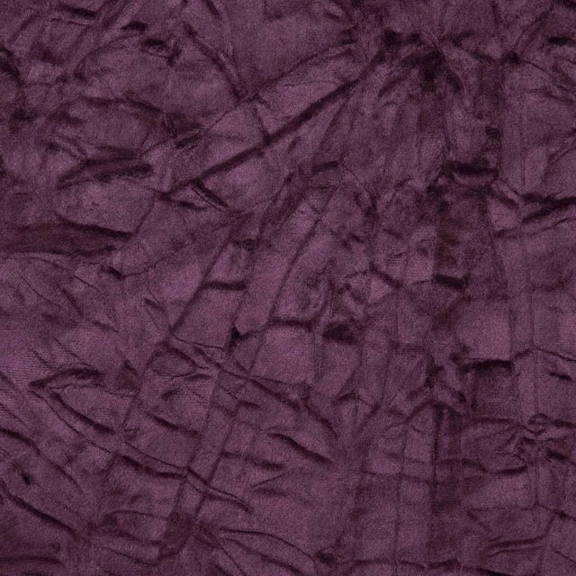 Deep aubergine textile with crushed plum texture and dark irregular tonal creases