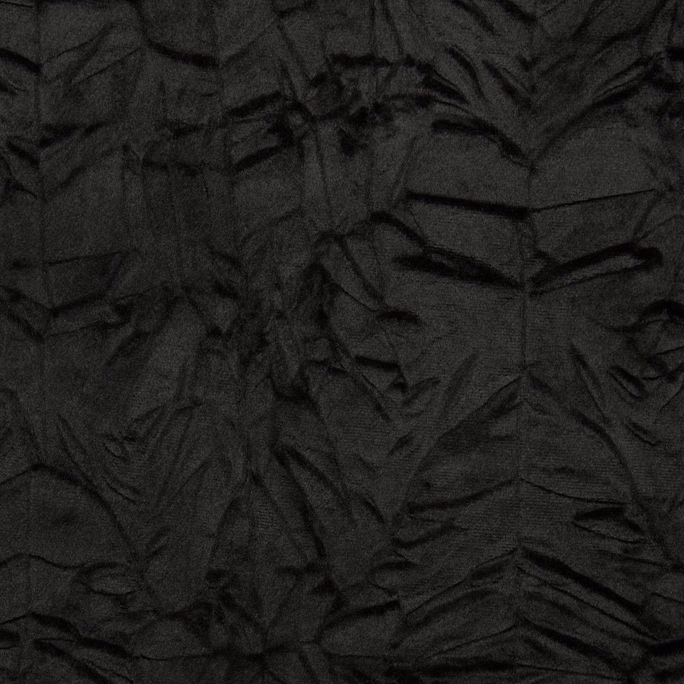 Jet-black textile with shadowy irregular leaf forms and finely crumpled woven texture