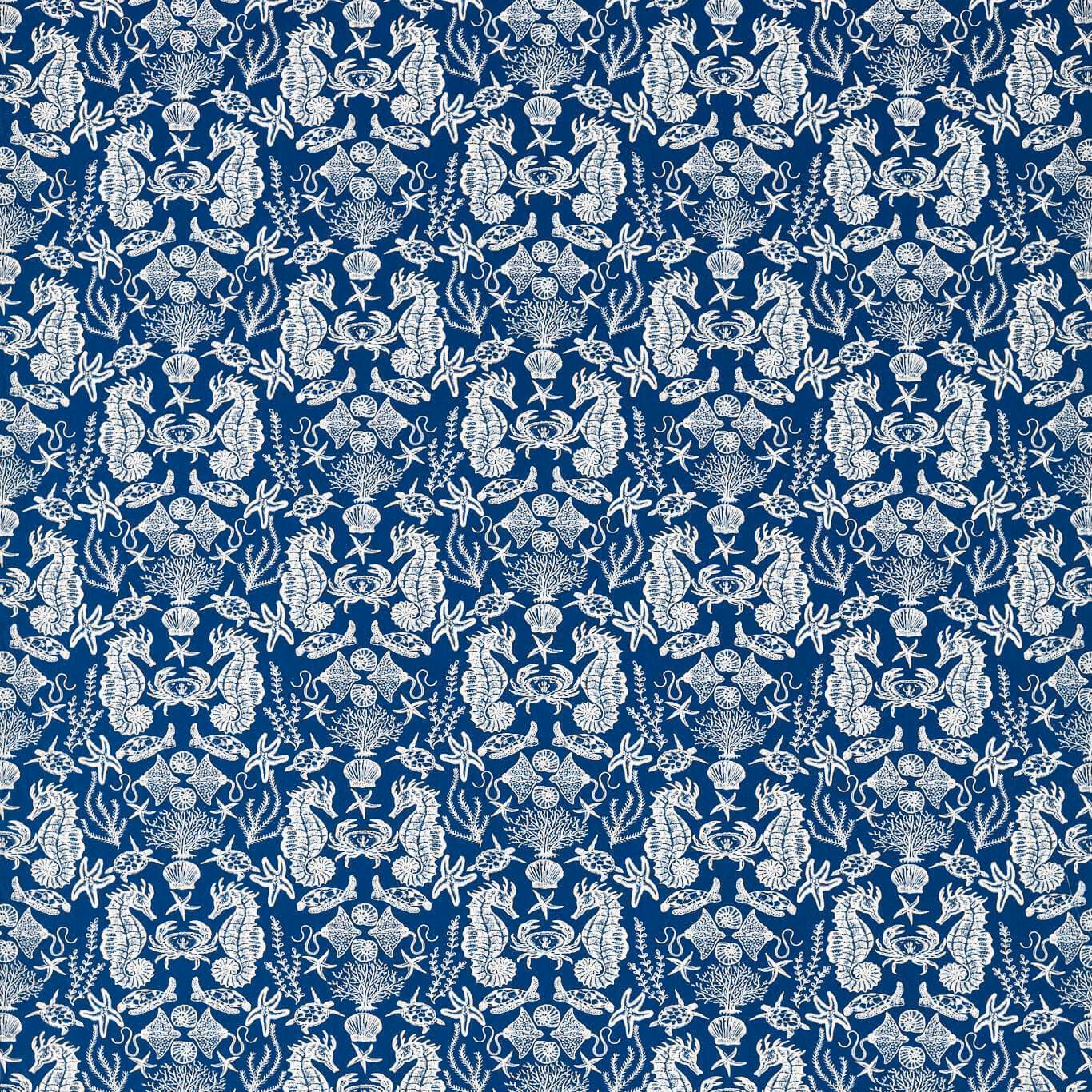 Deep navy fabric covered in dense ivory shells, coral and sea-life medallions