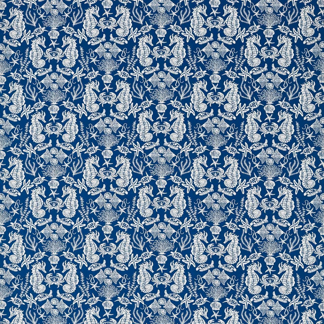 Deep navy fabric covered in dense ivory shells, coral and sea-life medallions