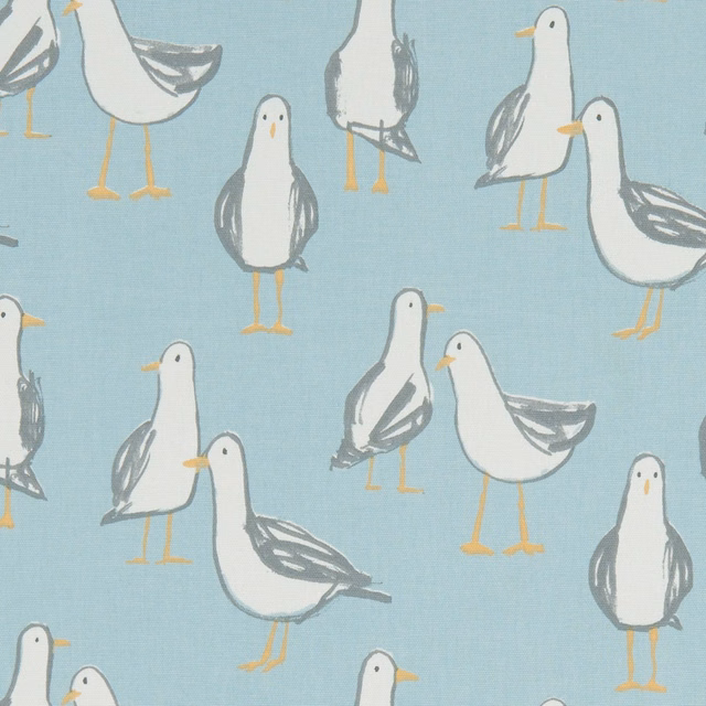 Muted duck-egg blue fabric with white gulls, grey wings and mustard legs