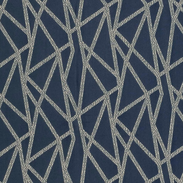Deep ink-blue woven fabric with pale stone angular lines in an irregular geometric pattern
