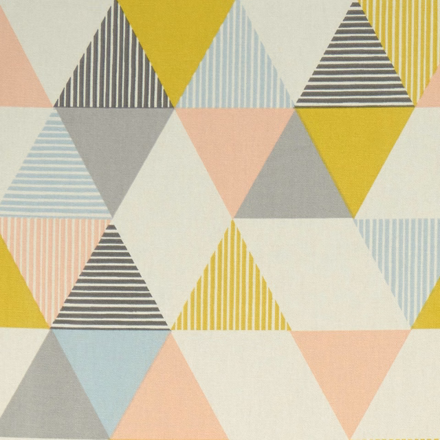 Pastel geometric triangles in mustard, pale blue, grey and peach on cream