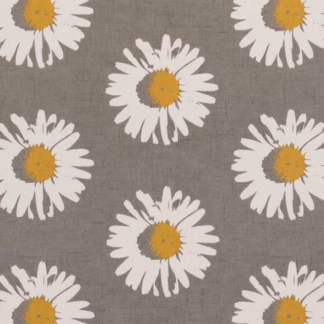 Grey woven fabric with oversized white daisies and yellow-chartreuse centres