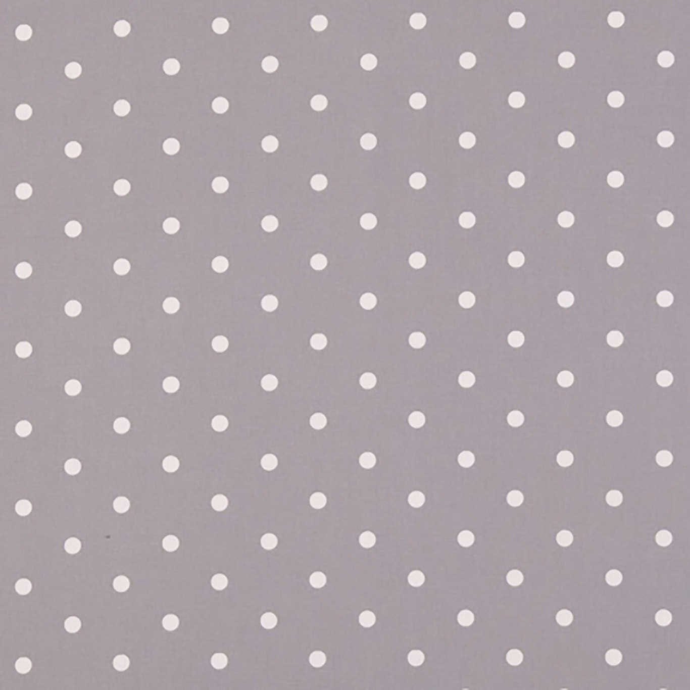 Ivory dots on a cool smoky grey-mauve woven fabric with a matte surface