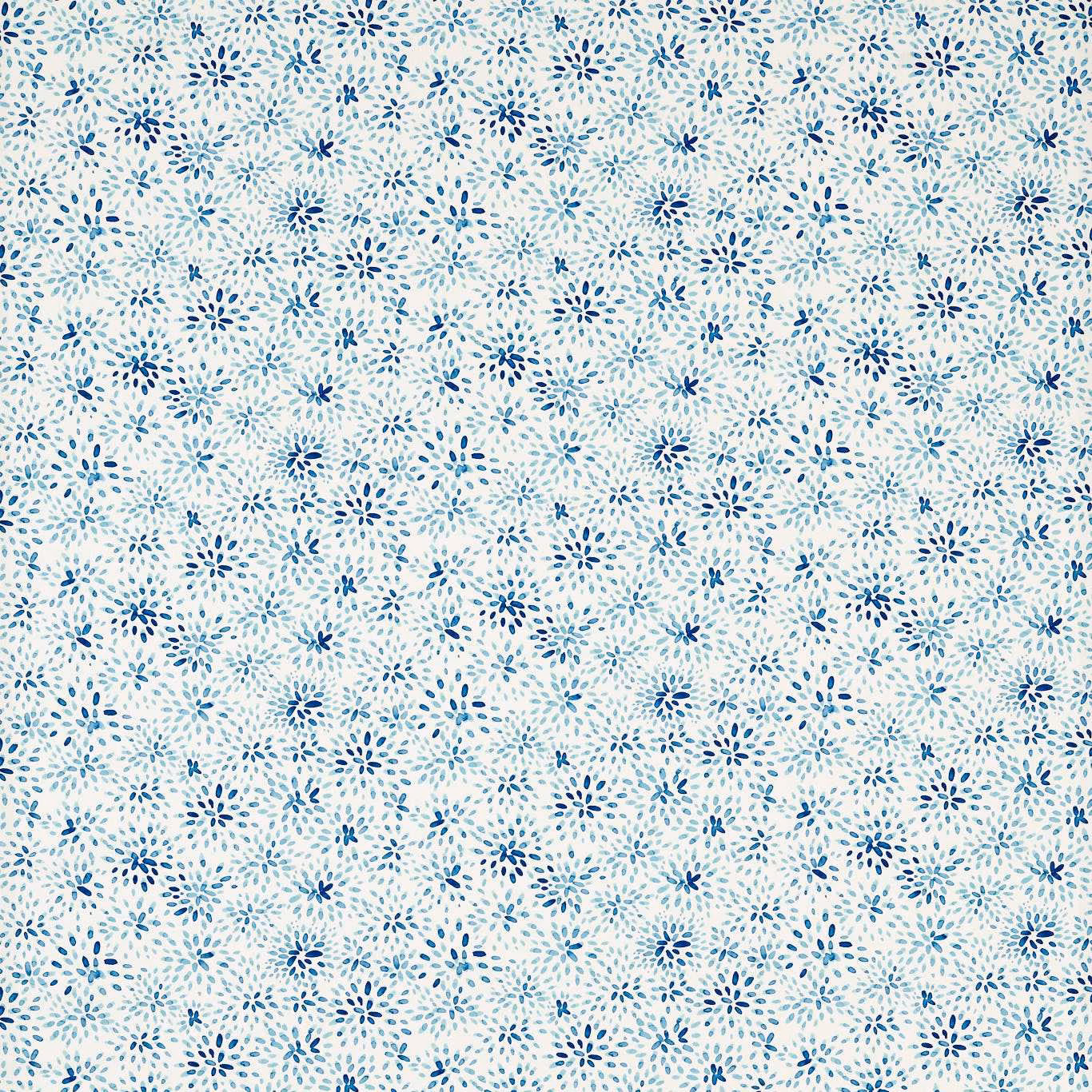 Cream fabric covered in small scattered cobalt and pale blue floral sprigs