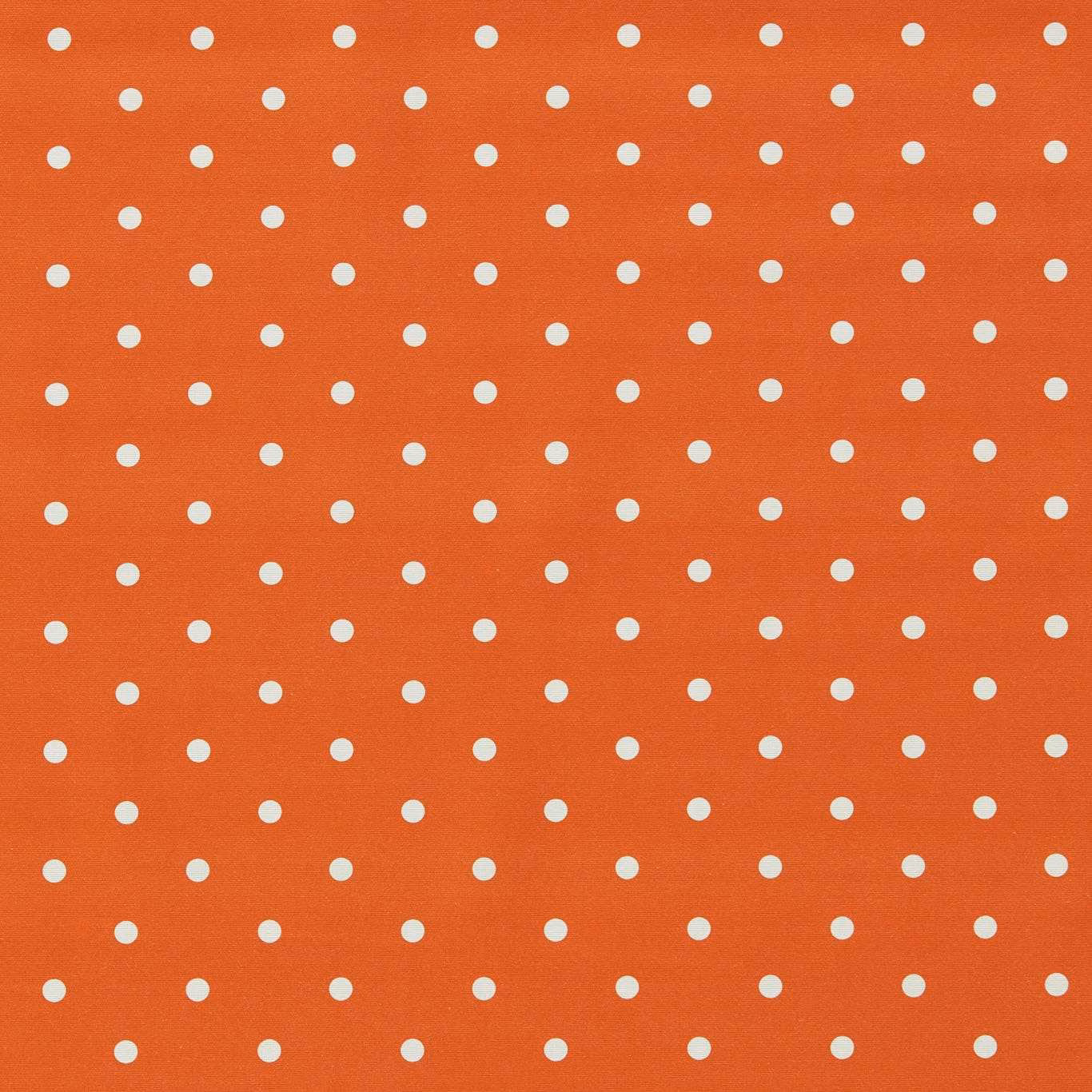 Burnt-orange fabric with evenly spaced small ivory dots and subtle surface texture