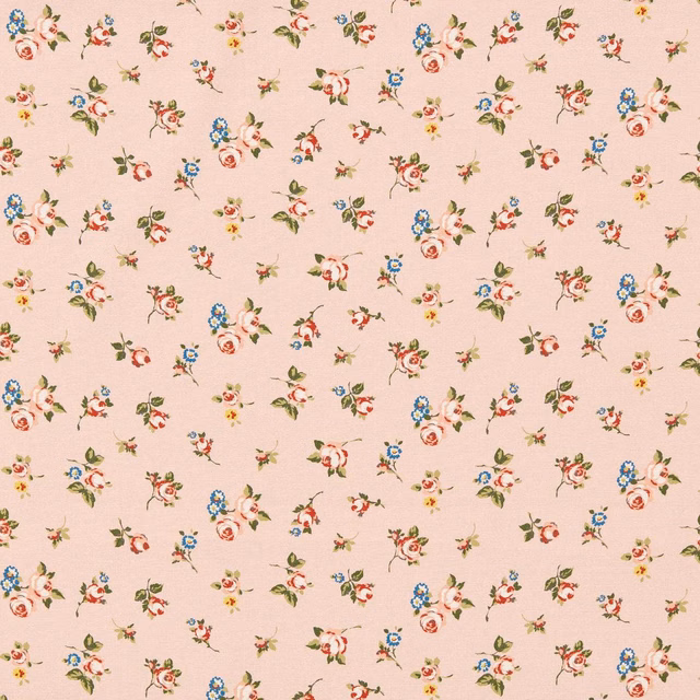 Blush-pink fabric with scattered tiny coral, blue, yellow and olive floral bouquets