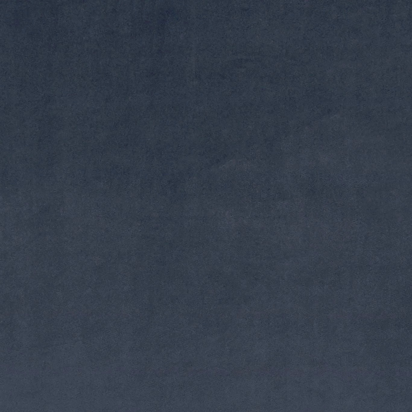Close-up of deep blue-black Murano fabric with softly mottled plain texture