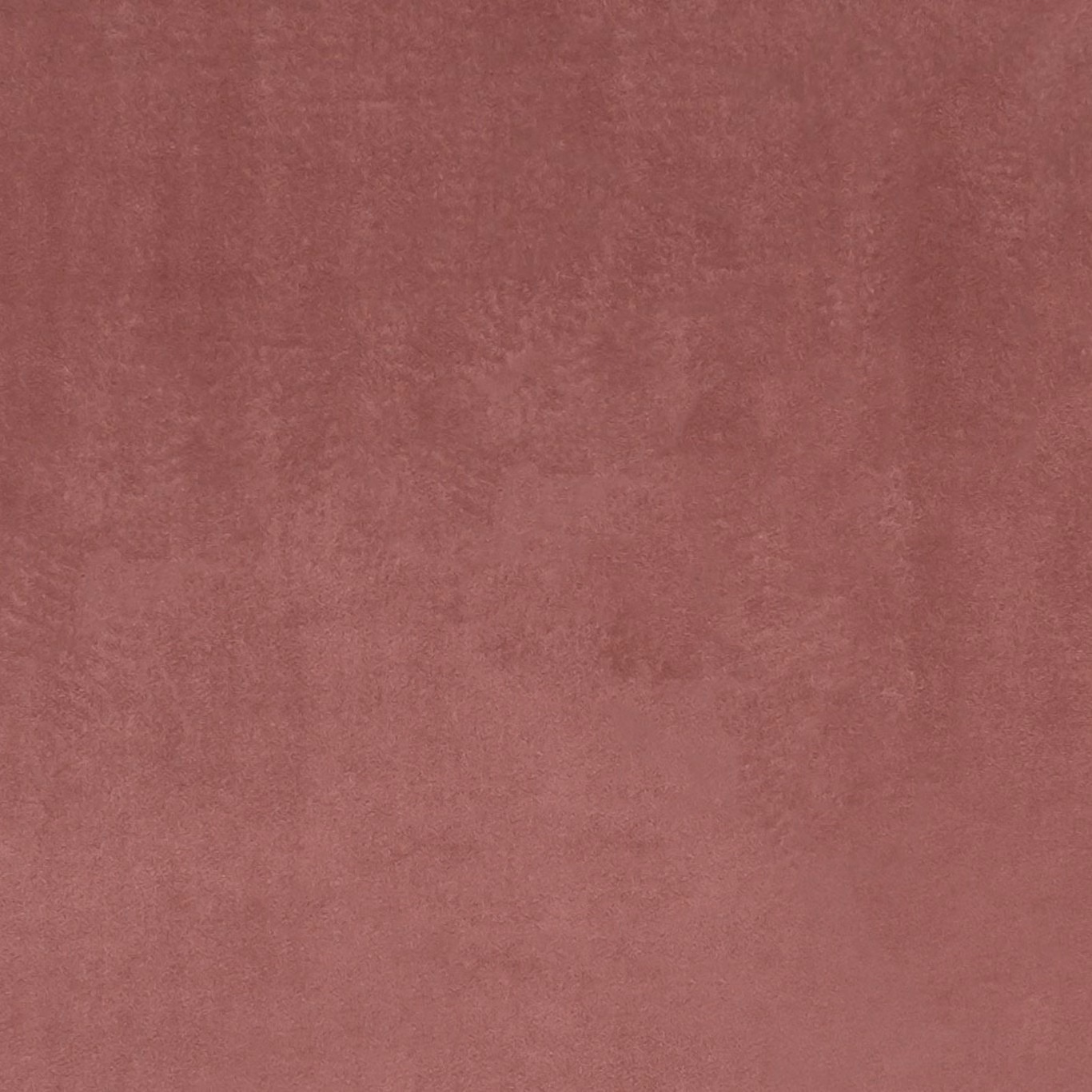 Muted old-rose textile with softly mottled, brushed-looking surface