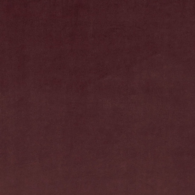 Deep oxblood fabric with subtle mottled texture and softly shifting burgundy tones
