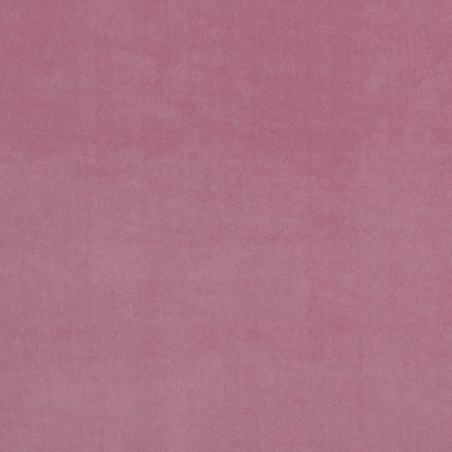 Dusty peony-pink fabric with a softly textured, tonal plain surface