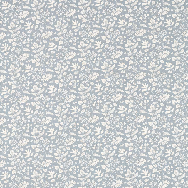 Muted denim-blue floral fabric with ivory leaves and winding botanical sprigs