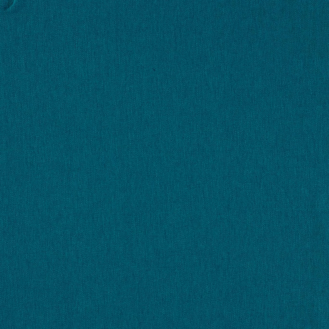 Close-up of deep kingfisher teal plain weave with subtle vertical texture