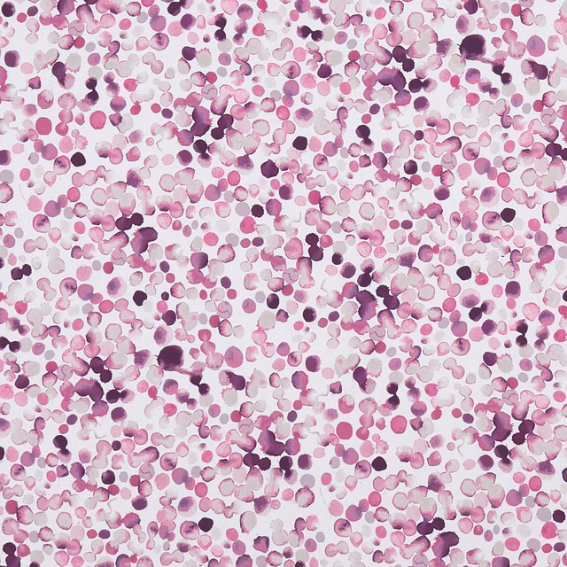 Dense magenta, plum and pink painterly spots scattered over a cream fabric ground
