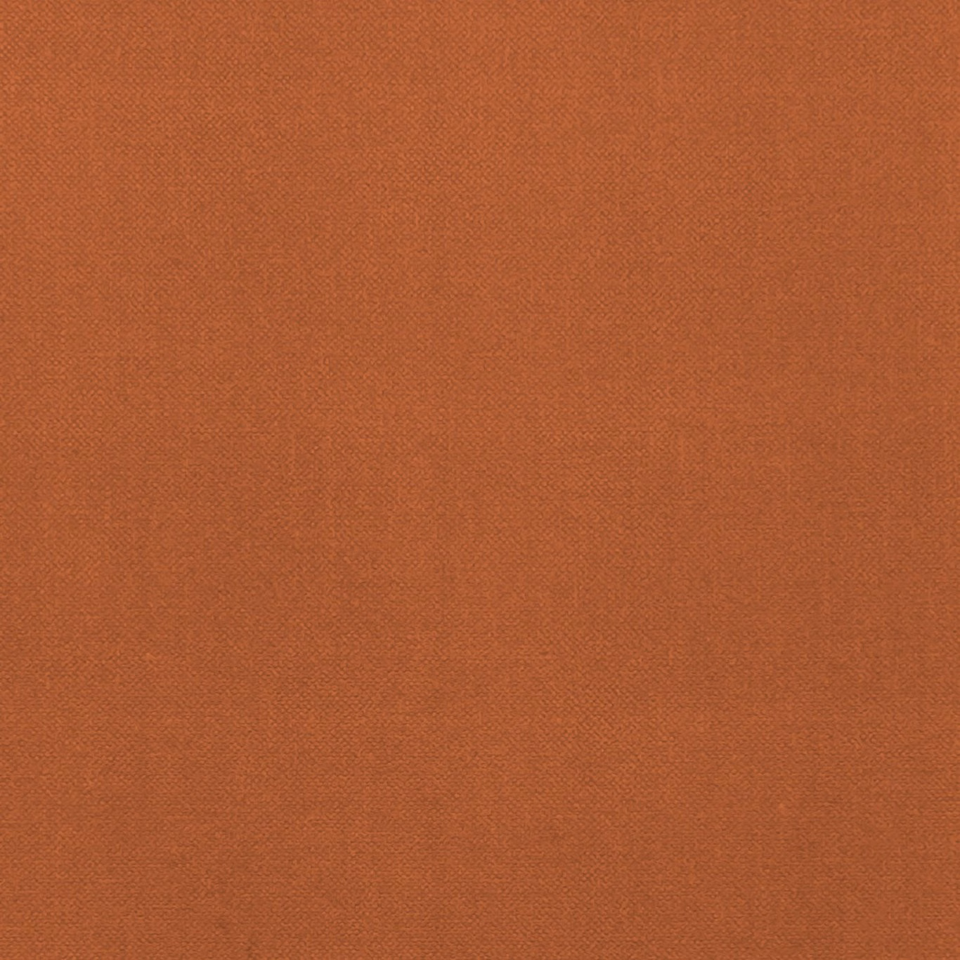 Close-up of warm spice terracotta fabric with a fine, even woven texture