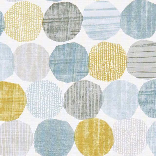Mineral blue, grey and ochre rounded motifs with softly striated textile texture
