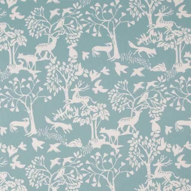 Ice blue woodland fabric with ivory deer, birds, trees and fine texture